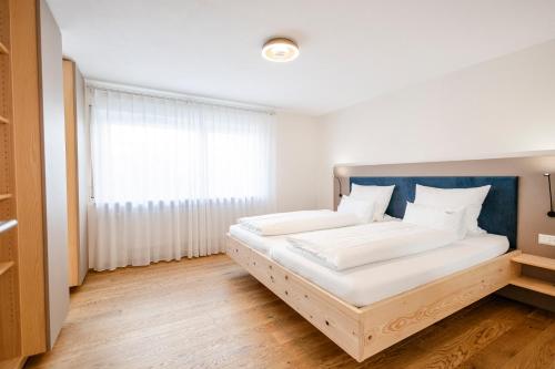 Postel nebo postele na pokoji v ubytování SEEZEIT Residence
