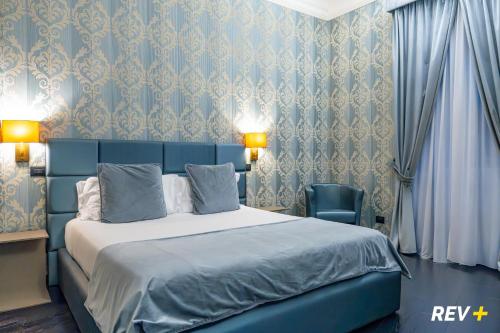 En eller flere senge i et værelse på Via Veneto Suites