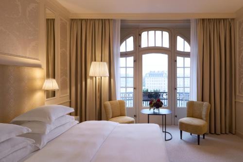 a hotel room with a large bed and a window at Hotel Diplomat Stockholm in Stockholm