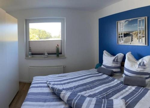 En eller flere senge i et værelse på Ferienwohnung Wiesenblick