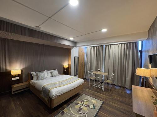 En eller flere senge i et værelse på Cloud Studio by The Erina House