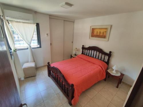 En eller flere senge i et værelse på Cabañas De Lourdes