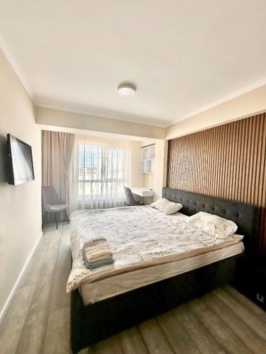 En eller flere senge i et værelse på Space Apartments