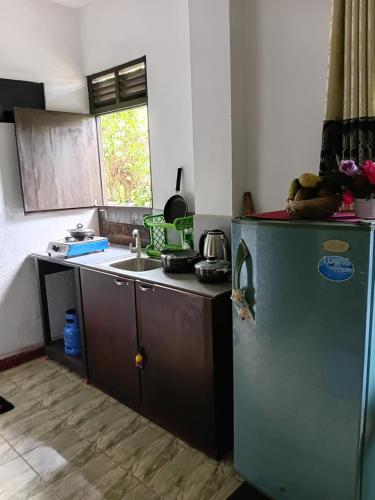Kuchyň nebo kuchyňský kout v ubytování Velvette Home Hikkaduwa