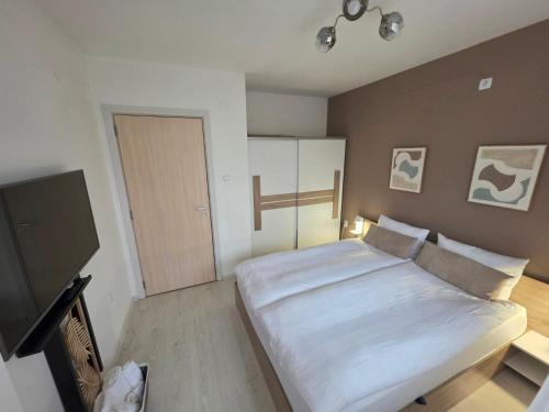 Een bed of bedden in een kamer bij APart Residence Shumen