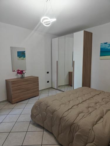 Giường trong phòng chung tại Bilocale vacanze