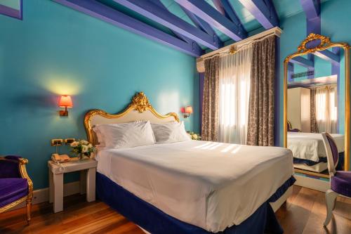 En eller flere senge i et værelse på Hotel Ca' Zusto Venezia