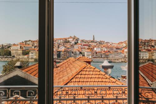 a view of a city from a window at Gran Cruz Apartments in Vila Nova de Gaia