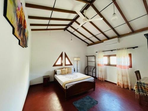 a bedroom with a bed in a room at Rich Hill Garden in Galle