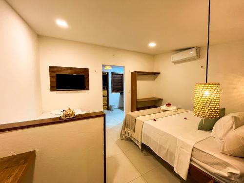 Chalés Mahalo J - Pontal de Maceió - Fortimにあるベッド