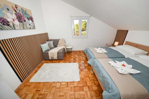 Postel nebo postele na pokoji v ubytování Apartmani Miluška