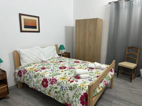 Postel nebo postele na pokoji v ubytování Micaelense Guest House