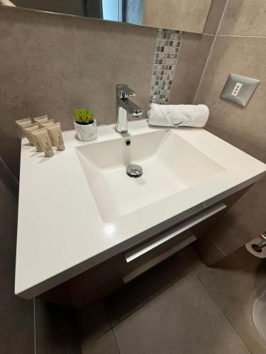 a bathroom with a white sink in a room at Beautiful loft with ocean views in Reñaca in Viña del Mar