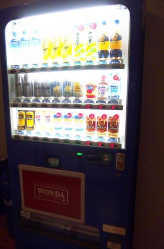 a vending machine filled with lots of drinks at Berg Marukaneya in Nozawa Onsen