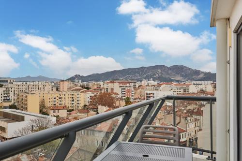 a balcony with a view of a city at Appart'hôtel Odalys City - Marseille Centre Parc Chanot Vélodrome in Marseille