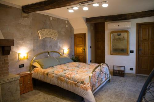 En eller flere senge i et værelse på Antico maniero La Ploca