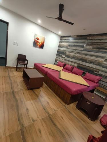 a bedroom with a large bed in a room at Zeenus Holiday Resort in Yercaud