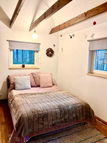 Postel nebo postele na pokoji v ubytování Heiniku Home