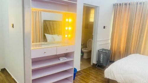 En eller flere senge i et værelse på Perfect Home