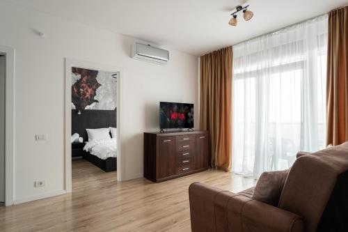 En eller flere senge i et værelse på Sika Diplomat Apartment