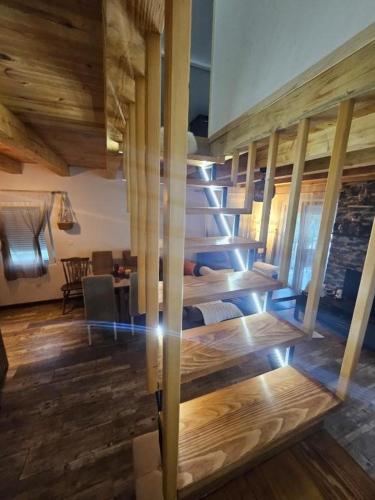 a large room with wooden floors and wooden ceilings at Village Drago in Cetinje