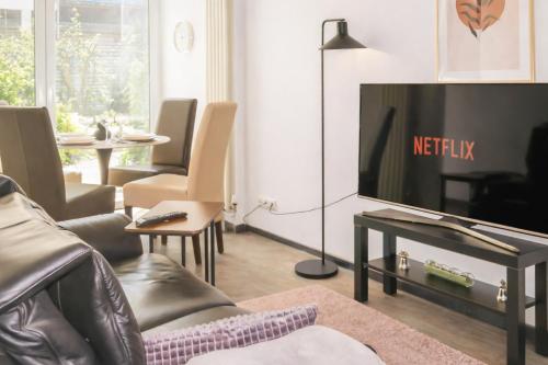 TV a/nebo společenská místnost v ubytování Brody Apartments - gemütlich wohnen nähe Büdingen