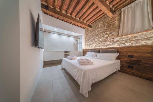 Ένα ή περισσότερα κρεβάτια σε δωμάτιο στο Loft SPA Massa Marittima
