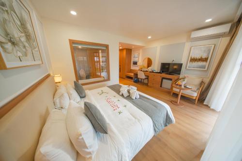 Ένα ή περισσότερα κρεβάτια σε δωμάτιο στο Villa Oasis Luang Prabang