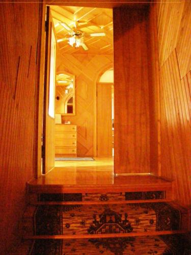 a hallway with a large mirror in a house at Home for Guests Lakštingala in Šiauliai