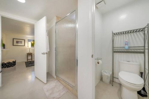 a bathroom with a toilet and a shower at 24th St (Deepak & Jackie) in Tucson