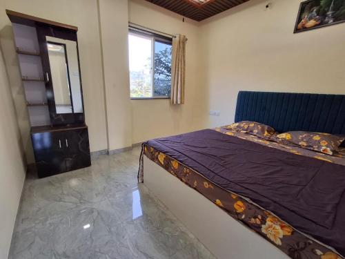 En eller flere senge i et værelse på Pawan villa cottage