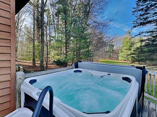 a hot tub on the back of a house at Almost Heaven in Swanton