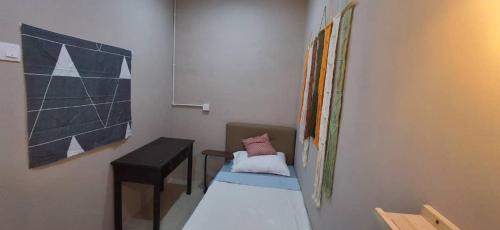 a room with a table and a chair in a room at Cozy Nook in George Town