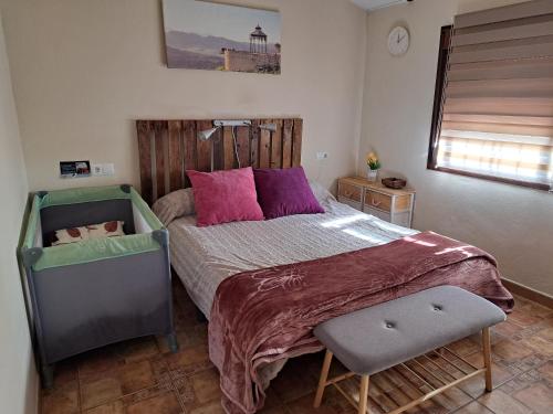 En eller flere senge i et værelse på Apartamento Rural Vainilla