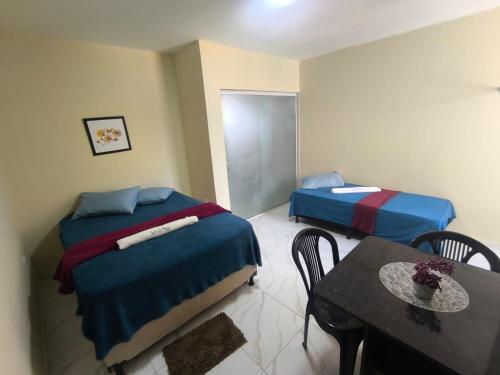 Postel nebo postele na pokoji v ubytování Suite da praia