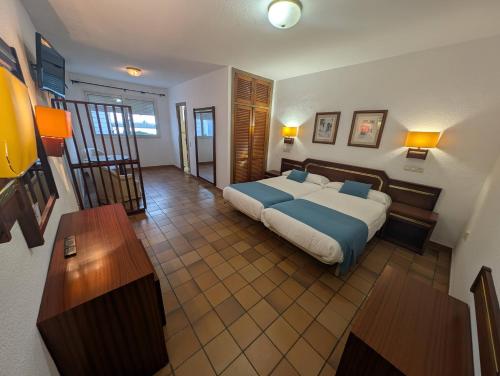 Postel nebo postele na pokoji v ubytování Hotel Santa María