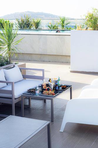 a tray of food on a coffee table on a patio at DIAGONAL HOTEL Tanger in Tangier