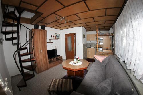 a living room with a couch and a table at Ferienhaus in Waren Müritz in Waren