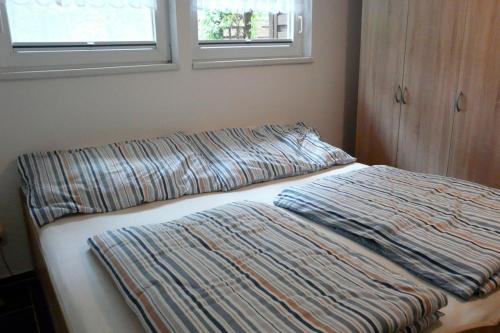 Postel nebo postele na pokoji v ubytování Ferienhaus Fleesensee