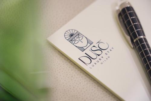 a close up of a book with a label on it at Duse Luxury Stay in Milan