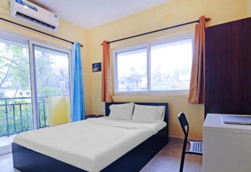 En eller flere senge i et værelse på Mariners Bay Suites