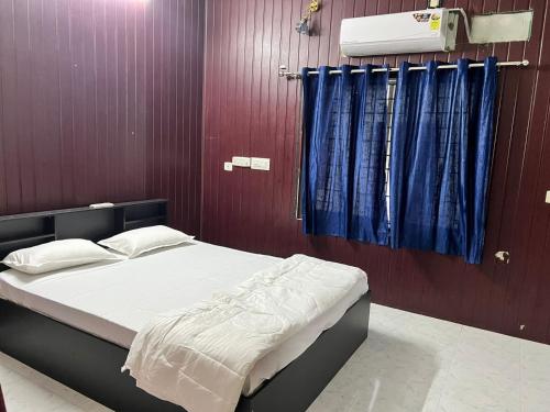 Postel nebo postele na pokoji v ubytování Sidhi Vinayaka Homestay