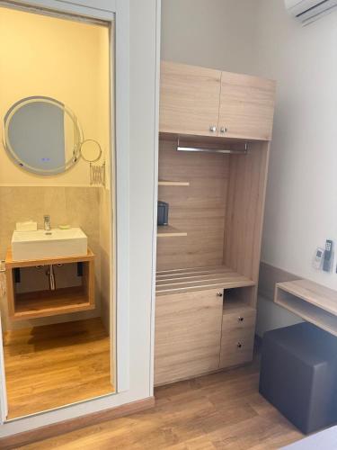 a bathroom with a sink and a mirror at Hotel Esperia in Sanremo