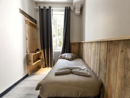 En eller flere senge i et værelse på Au ptit Tchestê