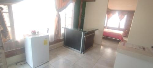 En eller flere senge i et værelse på Suits Plaza Jardin