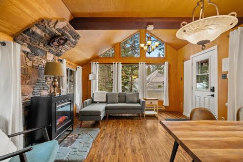 a living room with a couch and a fireplace at Elkhorn Lodge Vacation Rentals in Banff