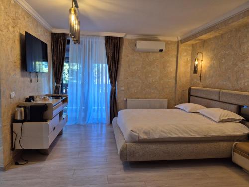 Postel nebo postele na pokoji v ubytování Perla Luxury Resort