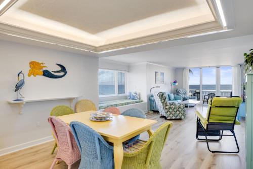 a living room with a table and chairs at Lighthouse Point 228- Stunning Beachside Residence in Sanibel