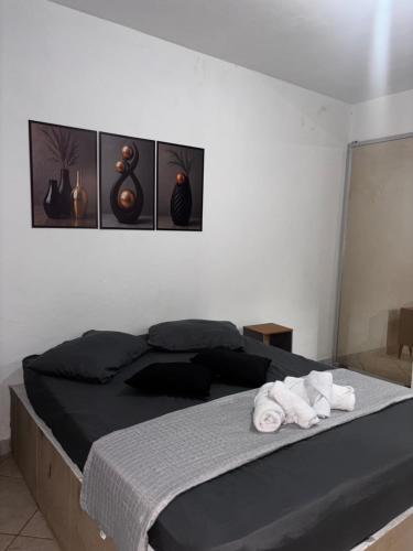 En eller flere senge i et værelse på Pousada Familia