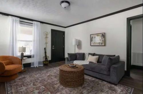 a living room with a couch and a coffee table at 3BR Downtown-Old Salem Oasis in Winston-Salem